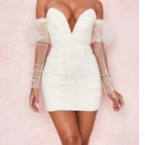 Off the shoulder, White dress with Crystal detail all over. From House of CB.